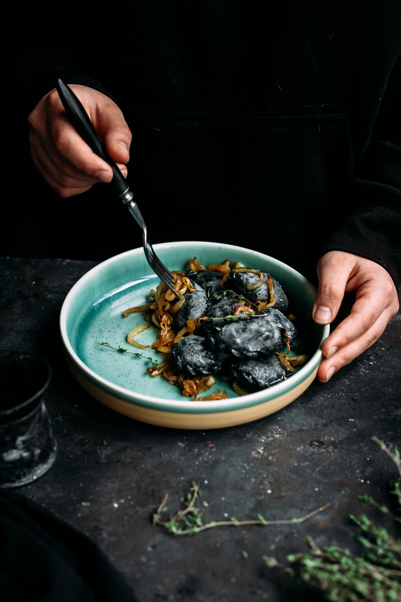Close-up of handcrafted plated dish on dark table